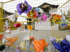 A growing memorial at the fatal house fire in Chestermere Lake where seven people died. Photo taken on Sunday, July 4, 2021.