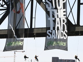 Greenpeace protesters hang from the High Level Bridge in Edmonton on Nov. 7, 2007, in a protest against the Alberta oilsands.
