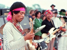 This handout photo by Henry Diltz shows musician Jimi Hendrix at the Woodstock festival in Bethel, N.Y. in August 1969.