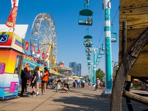 The midway starts to fill up soon after opening on the second last day of the 2021 Calgary Stampede on Saturday, July 17, 2021.