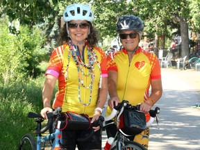 Dale Zukowski and Anne Cameron pose for a photo on the Bow River Pathway prior to an upcoming fundraiser. The bereaved parents of cancer victims doing a bike fundraiser for cancer research and plan to cycle from Banff to Lake Louise tomorrow. Saturday, July 17, 2021. Brendan Miller/Postmedia