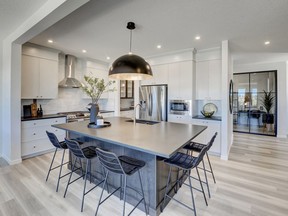 The kitchen in the Clairmont show home by Cedarglen Homes in Encore West Grove Estates.