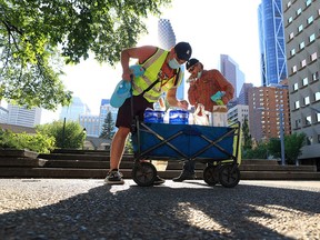 Be The Change YYC team members hand out water, hats and other supplies to vulnerable Calgarians during a heat wave on Monday, June 28, 2021.