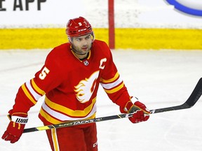 Calgary Flames Mark Giordano battles the Vancouver Canucks in third NHL action at the Scotiabank Saddledome in Calgary on Wednesday, May 19, 2021.