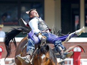 Caleb Bennett from Corvallis,MT, riding Super 8 during the Bareback event on day 7 of the 2021 Calgary Stampede rodeo in Calgary on Thursday, July 15, 2021. Darren Makowichuk/Postmedia