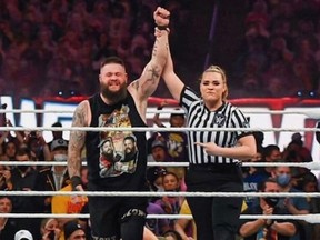 WWE official Jessika Carr raised the hand of Kevin Owens in victory at WrestleMania 37, where she also made history.