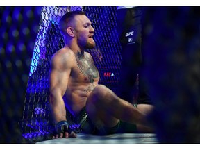 Conor McGregor reacts following an injury suffered against Dustin Poirier during UFC 264 at T-Mobile Arena in Las Vegas.