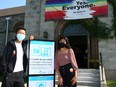 Hanson Fang and Nikhat Saheb, with the Centre for Newcomers, pose for a photo outside St. Stephen's Church where a Pride Vaccine Clinic has been set up prior to next months Pride Events. Saturday, July 17, 2021.