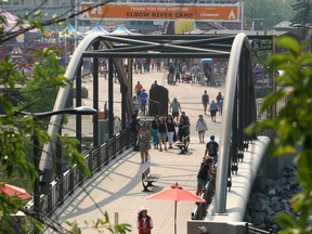 People are seen entering the Elbow River Camp on the Stampede Grounds. Friday, July 16, 2021.