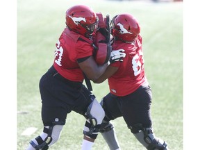 Calgary Stampeders offensive lineman battle it out during the CFL team's training camp in Calgary on Saturday, July 10, 2021. Jim Wells/Postmedia