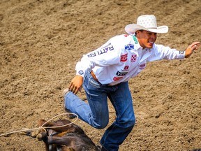 Shad Mayfield,  Clovis NM, posted a time (6.5 seconds) on Day 8 of the tie-down roping event at the Calgary Stampede rodeo on Friday, July 16, 2021. Al Charest / Postmedia