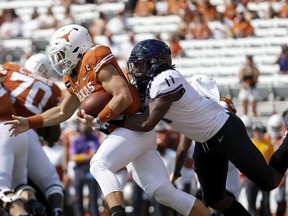 AUSTIN, TEXAS - OCTOBER 03: Khari Coleman #11 of the TCU Horned Frogs tackles Sam Ehlinger #11 of the Texas Longhorns near the goal line in the first half at Darrell K Royal-Texas Memorial Stadium on October 03, 2020 in Austin, Texas.