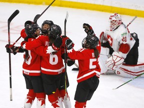 Team Canada's Rebecca Johnston scores on Team Switzerland's goalie Andrea Braendli in third period action during the 2021 IIHF Women’s World Championship semi-finals at the Winsport arena in Calgary on Monday, August 30, 2021.