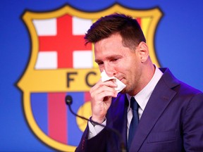Lionel Messi of FC Barcelona faces the media during a press conference at Nou Camp on Aug. 8, 2021 in Barcelona.