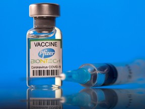 A vial labelled with the Pfizer-BioNTech COVID-19 vaccine is seen in this illustration picture taken March 19, 2021.