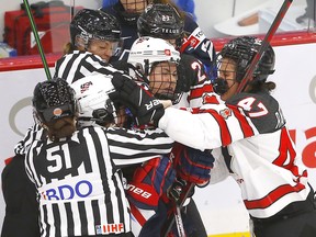 Tempers flare between Team Canada and Team USA in second period action during the 2021 IIHF Women’s World Championship at the Winsport arena in Calgary on Thursday, August 26, 2021.