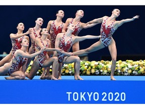 Team Canada competes in the team free routine artistic swimming event during the Tokyo 2020 Olympic Games at the Tokyo Aquatics Centre in Tokyo on August 7, 2021. (Photo by Attila KISBENEDEK / AFP)