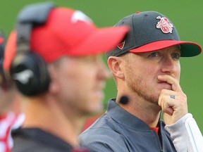 Calgary Stampeders head coach Dave Dickenson and Bo Levi Mitchell on the sidelines during a game gainst the Montreal Alouettes during CFL football in Calgary on Friday, August 20, 2021. Al CHAREST / POSTMEDIA