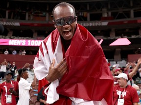 Qatar's gold medalist Mutaz Essa Barshim celebrates on the track following the Men's High Jump Final during the Tokyo 2020.