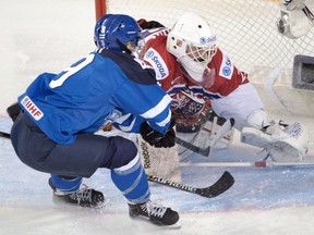 Czech Republic goaltender Klara Peslarova, picturing making a save off Finland’s Venla Hovi during the 2016 IIHF women’s world championship in Kamloops, B.C., stopped 24 shots to earn the shutout in a 4-0 win over Japan during the 2021 tournament in Calgary.