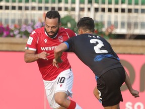 Cavalry FC Sergio Camargo (L) takes on Edmonton FC Paris Gee During CPL soccer action in Calgary between Cavalry FC and Edmonton FC at Atco Field onTuesday, August 3, 2021. Jim Wells/Postmedia