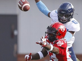 The Calgary Stampeders Josh Huff comes up short with Toronto Argonauts Robertson Daniel all over him in CFL action at McMahon stadium in Calgary on Saturday, August 7, 2021. Darren Makowichuk/Postmedia