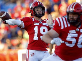 Calgary Stampeders quarterback Bo Levi Mitchell throws a pass against the B.C. Lions in first half CFL action at McMahon stadium in Calgary Thursday, August 12, 2021.