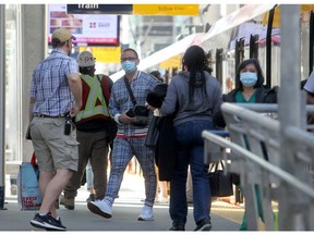 People wearing masks are seen entering and leaving the C-Train downtown. Wednesday, August 25, 2021. Brendan Miller/Postmedia
