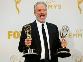 Jon Stewart holds his awards for Outstanding Writing For A Variety Series and Outstanding Variety Talk Series for Comedy Central's "The Daily Show With Jon Stewart" during the 67th Primetime Emmy Awards in Los Angeles, California September 20, 2015.