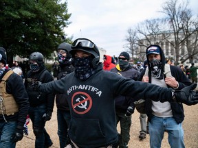 Protester who claim to be a members of the Proud Boys gather with other supporters of U.S. President Donald Trump outside the Capitol on January 6, 2021, in Washington, D.C.