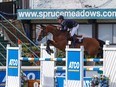 Canada's Mario Deslauriers and Bardolina 2 compete at Spruce Meadows on Saturday in Calgary. The horse-rider combination won the ATCO Queen Elizabeth II Cup grand prix at The North American show-jumping tournament.