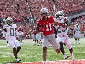 COLUMBUS, OH - SEPTEMBER 11: Wide receiver Jaxon Smith-Njigba #11 of the Ohio State Buckeyes runs in a touch down as safety Verone McKinley III #23 Oregon Ducks chases him down in the third quarter at Ohio Stadium on September 11, 2021 in Columbus, Ohio.