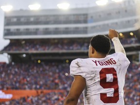 Alabama Crimson Tide QB Bryce Young celebrates after defeating the Florida Gators 31-29 at Ben Hill Griffin Stadium on Saturday in Gainesville, Fla.
