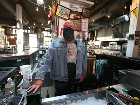 Arlen Smith, GM of the Palomino Smokehouse in Calgary poses behind the bar of the downtown establishment in Calgary on Thursday, September 9, 2021.