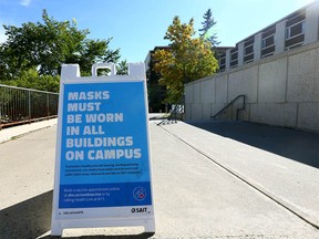 Signs around the SAIT campus in Calgary reminding visitors, staff, students to wear masks are shown on Thursday, September 16, 2021.