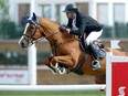 Egypt’s Nayel Nassar rides Oaks Redwood to victory in the Scotiabank Cup during Spruce Meadows’ North American show jumping tournament on Friday, Sept.17, 2021.