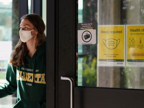 A student exits the Students Union Building at the University of Alberta in Edmonton on Thursday September 14, 2021. Effective November 1, 2021 all students, staff and visitors to the university will require proof of full COVID-19 vaccination. A negative result from rapid testing will no longer be accepted. Nine post-secondary institutions in Alberta have adopted the pandemic policy.