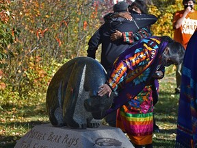 For some it was emotional as Enoch held a unveiling ceremony of its new monument dedicated to "survivors" of residential schools behind the Maskêkosak Kiskinomâtowikamik School west of Edmonton on Wednesday, Sept. 29, 2021.