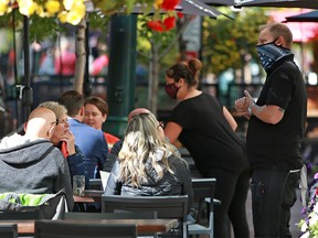 Calgarians dined over the lunch hour on restaurant patios along Stephen Avenue Mall on Thursday, September 16, 2021. Alberta announced new COVID-19 restrictions which will affect restaurants starting on Sept. 20.