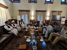 Mullah Baradar, head of the Taliban's Political Office, meets with members of the Red Cross in Kabul, Afghanistan, in this image uploaded onto social media on September 6, 2021.