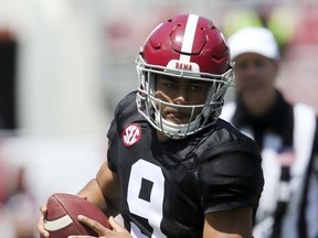Crimson Tide QB Bryce Young scrambles for a first down during Alabama's spring NCAA college football game at Bryant-Denny Stadium on April 17 in Tuscaloosa, Ala.