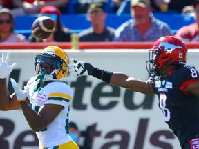 The Edmonton Elks' Earnest Edwards makes a touchdown catch in front of Stampeders DB DaShaun Amos during Monday's Labour Day Classic at McMahon Stadium in Calgary.