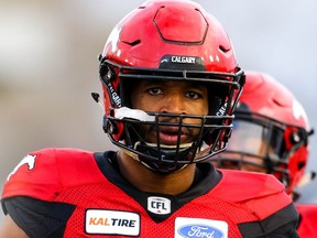 Jameer Thurman of the Calgary Stampeders runs onto the field during player introductions before facing the BC Lions in CFL football on Saturday, October 13, 2018. Al Charest/Postmedia