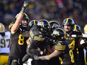 Tiger-Cats quarterback David Watford celebrates his touchdown with teammates during CFL East Final football action against Edmonton in Hamilton in this photo from Nov. 17, 2019.