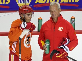 Calgary Flames forward Johnny Gaudreau chats with head coach Darryl Sutter during the first practise of training camp on Thursday, September 23, 2021.

Gavin Young/Postmedia