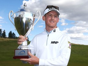 Jared du Toit hoists the winning trophy in Calgary at Country Hills Golf Club on Sunday, September 19, 2021. He won the ATB Financial Classic on the Mackenzie Tour. Jim Wells/Postmedia