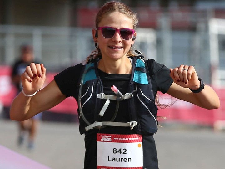  Lauren Barr from Calgary celebrates as she finishes first in the women’s portion of the Scotiabank Calgary Marathon in Calgary on Sunday, September 19, 2021. She finished the 42.2 km course with a time of 2 hours 56 minutes and 43 seconds.