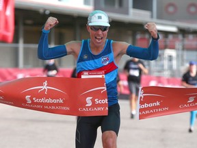 Justin Kurek celebrates as he finishes first in the men's portion of the Scotiabank Calgary Marathon in Calgary on Sunday, September 19, 2021. He finished the 42.2 km course with a time of 2 hours 33 minutes and 15 seconds. Jim Wells/Postmedia