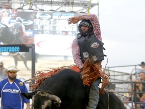 Bullrider Griffin Smeltzer from Claresholm,AB, third ride on Pure Feeling during night three of the Cody Snyder Charity Bullbustin', an event featuring exceptional event production, producing Calgary's favourite party of the summer for over 20 years. The event features the top bull riders in the world, with all points won counting towards the PBR World Finals in Las Vegas. The event has raised over 2 million dollars for Alberta charities, supporting Special Olympics Alberta, Canadian Mental Health Association Calgary and the Calgary and Central Alberta Child Advocacy Centres in 2021 at the Grey Eagle Resort and Casino in Calgary on Thursday, September 9, 2021. Darren Makowichuk/Postmedia