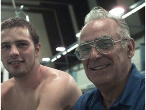 (CALH) 8 May, 1996--SWIMMER 7---Curtis Myden and his Olympic Swim Coach, Deryk Snelling, chat before a training session at the U of C pool.  Photo by Tannis Toohey, Calgary Herald.